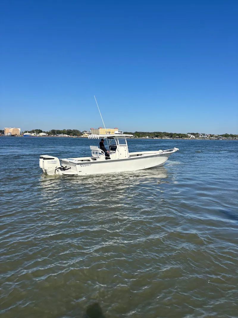 Slide: The Image of Egret 290 boat from 2019 on calm waters. - 0