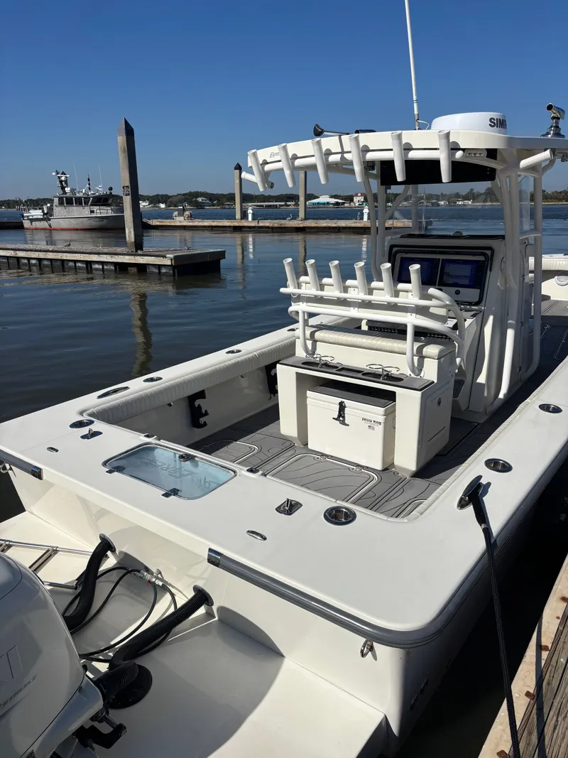 Slide: The Image of Egret 290 boat from 2019 docked at harbor, clear sky. - 10