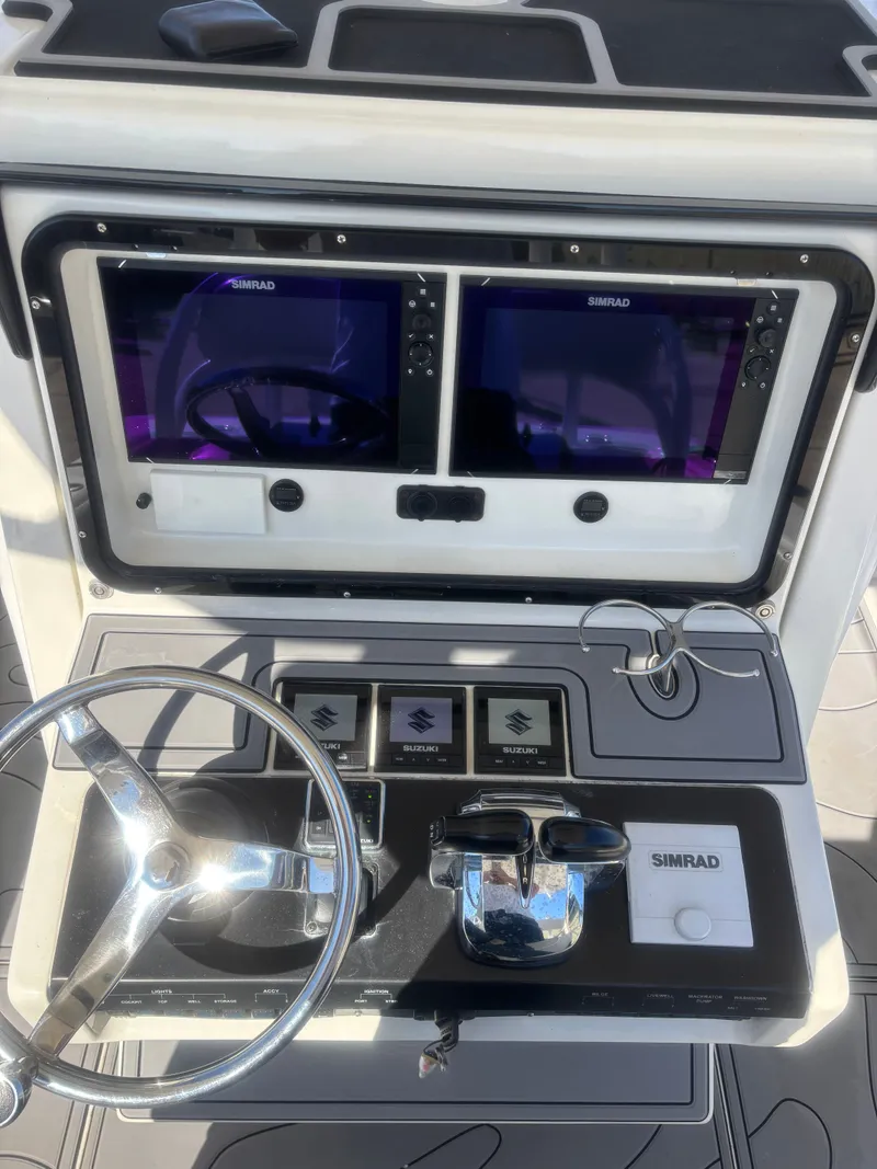 Slide: The Image of Egret 290 boat helm console, 2019 model, featuring Simrad electronics. - 12