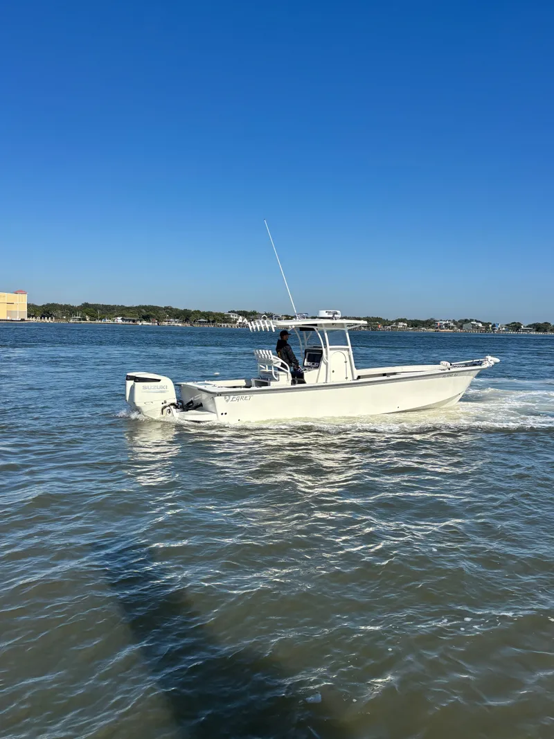 Slide: The Image of Egret 290 boat from 2019 on calm waters. - 4