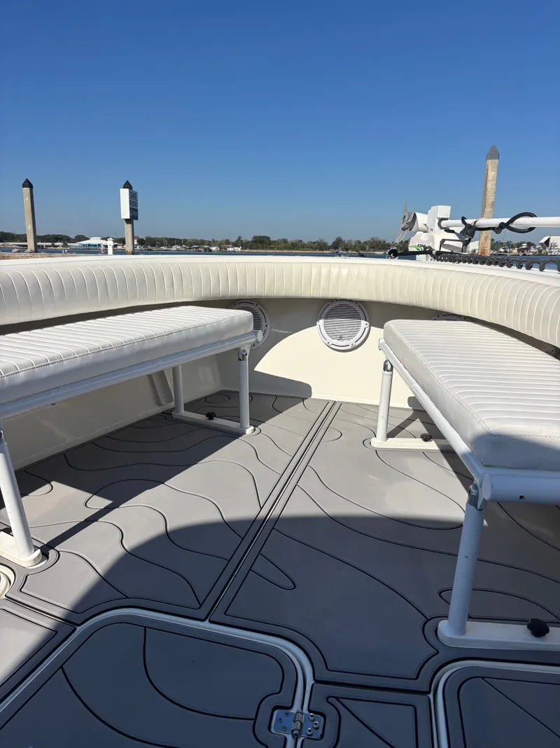 Slide: The Image of Interior view of a 2019 Egret 290 boat with seating benches. - 6