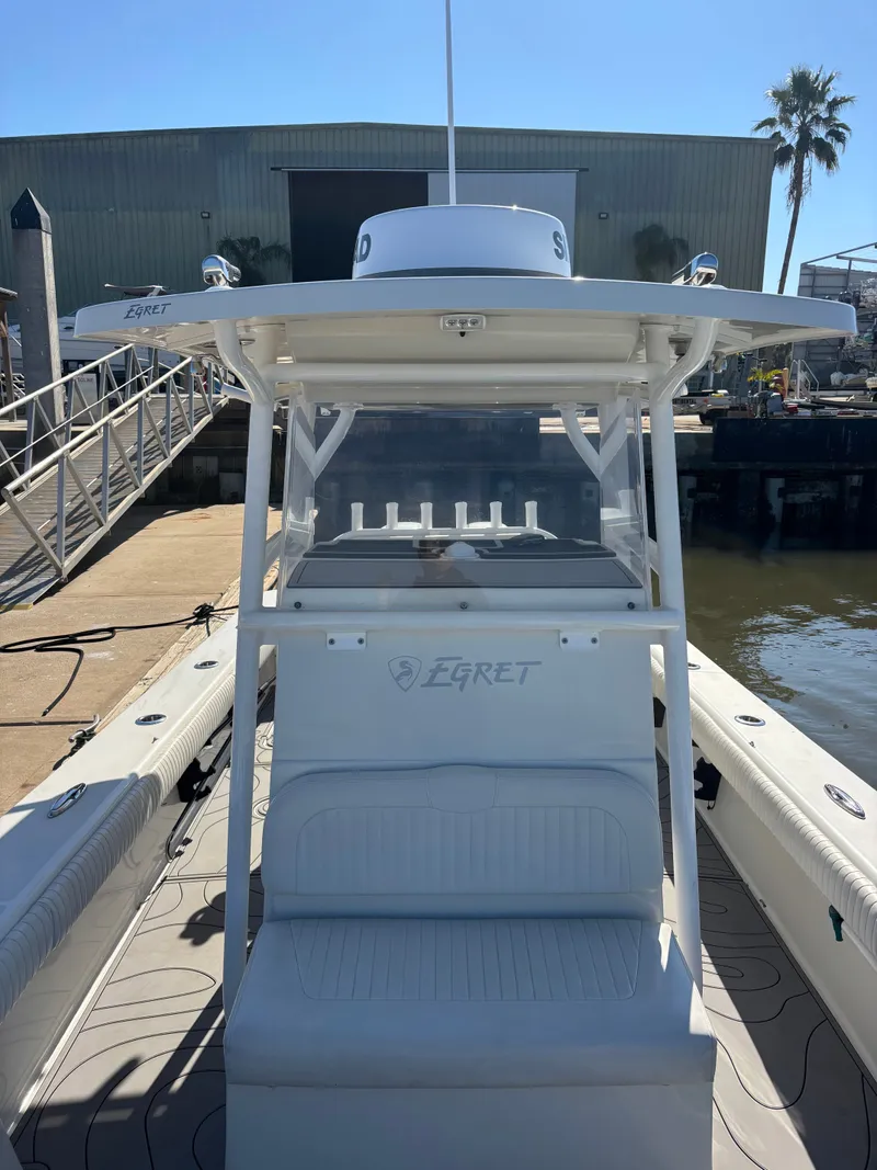 Slide: The Image of Egret 290 boat from 2019 at dock, front view. - 8