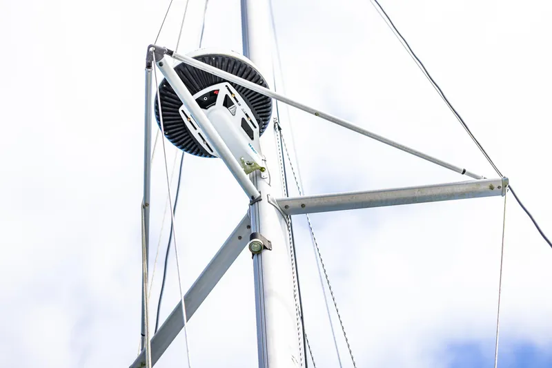 Slide: The Image of Close-up of a 2014 Gemini Legacy 35 sailboat mast against a cloudy sky. - 10