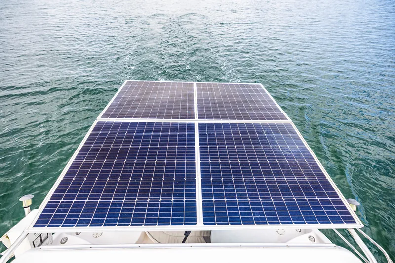 Slide: The Image of Solar panels on a 2014 Gemini Legacy 35 boat, floating on water. - 22
