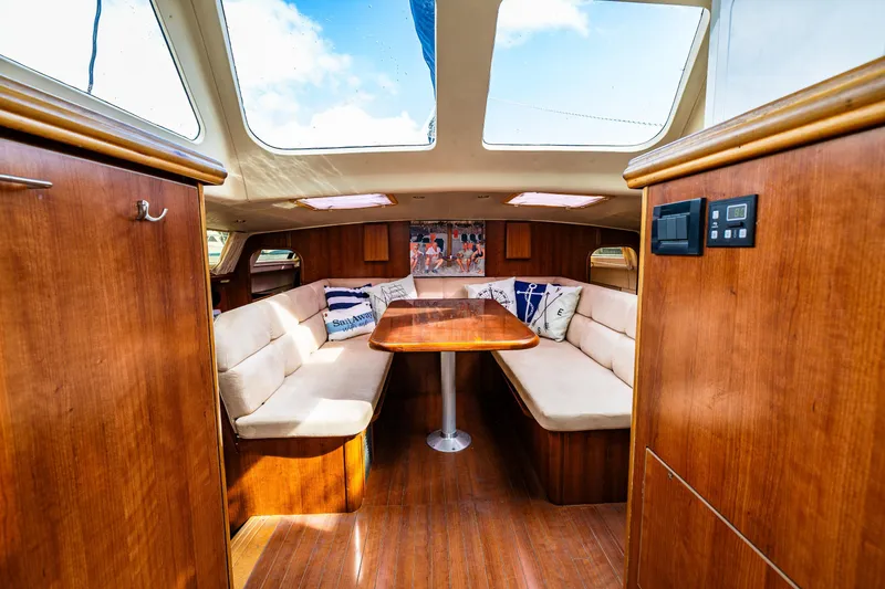 Slide: The Image of Interior of 2014 Gemini Legacy 35 sailboat with wooden finishes and seating area. - 25