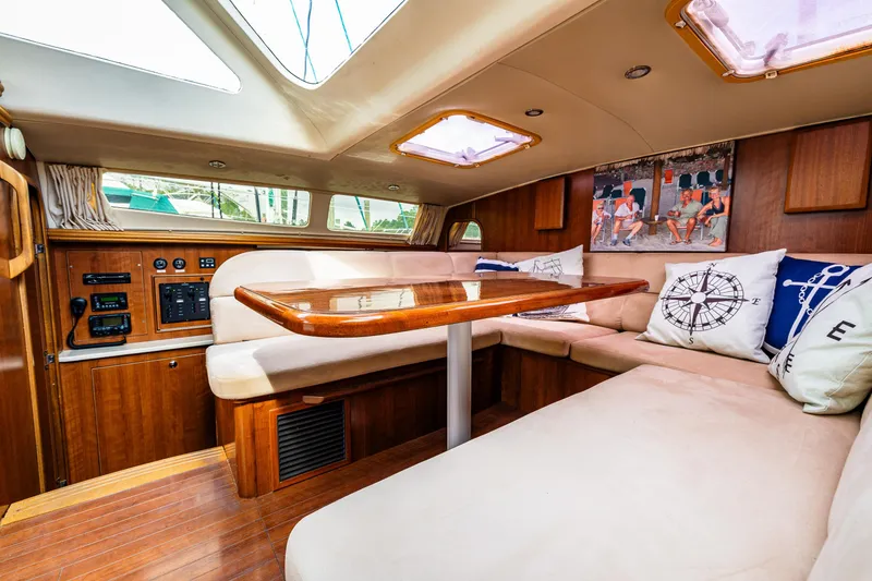 Slide: The Image of Interior of 2014 Gemini Legacy 35 sailboat with cozy seating and nautical decor. - 26