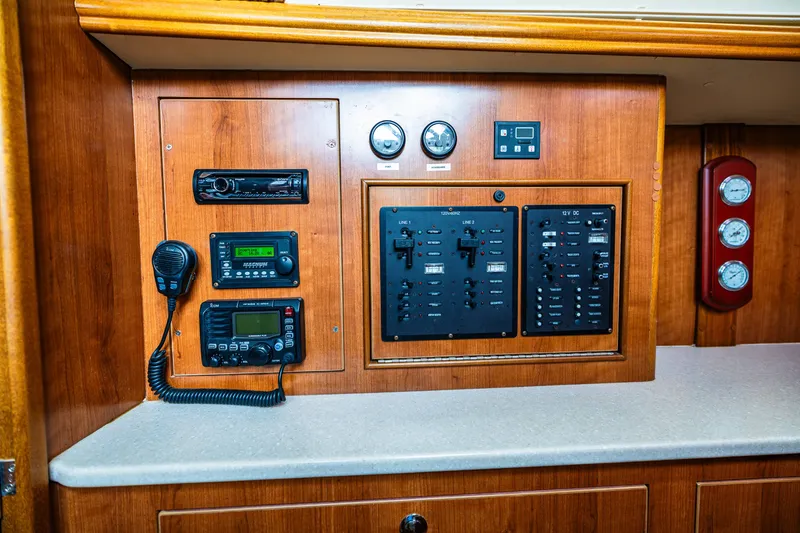 Slide: The Image of Control panel of a 2014 Gemini Legacy 35 boat with communication and navigation equipment. - 29