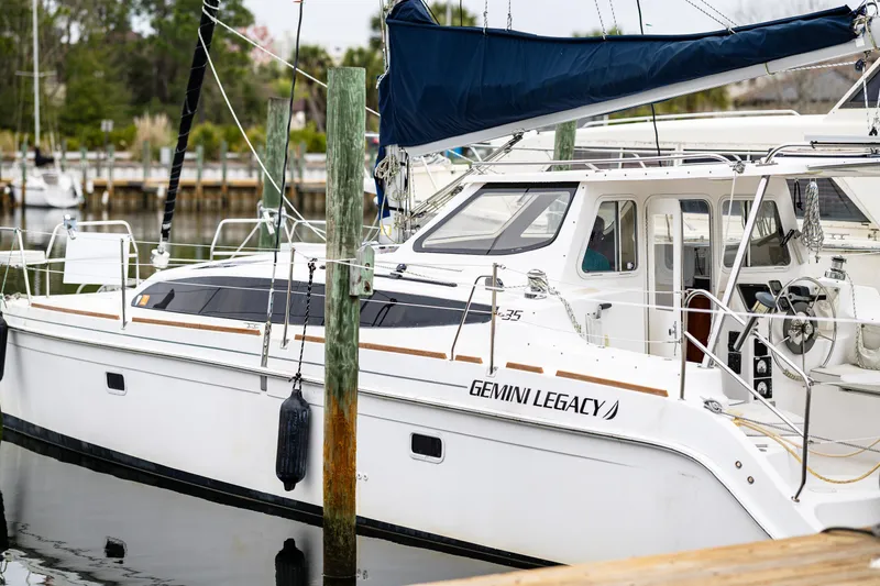 Slide: The Image of 2014 Gemini Legacy 35 sailboat docked in a marina, featuring sleek design and modern amenities. - 39