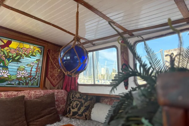 Slide: The Image of Interior of 1972 Islander 40MS with stained glass and nautical decor. - 5