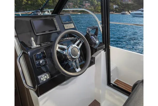 Slide: The Image of Manufacturer Provided Image: Helm of 2026 Jeanneau NC 895 Series 2 boat with modern controls and scenic water view. - 8