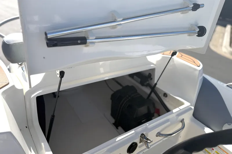 Slide: The Image of Open storage compartment of 2017 Avon Seasport 420 boat, showing interior details. - 11
