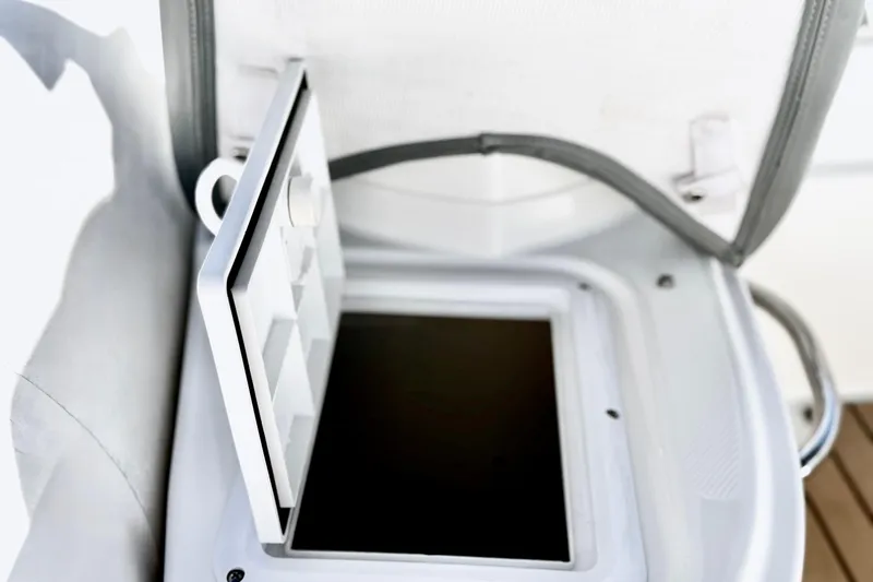 Slide: The Image of Open storage compartment on 2017 Avon Seasport 420 boat, showcasing interior space. - 18