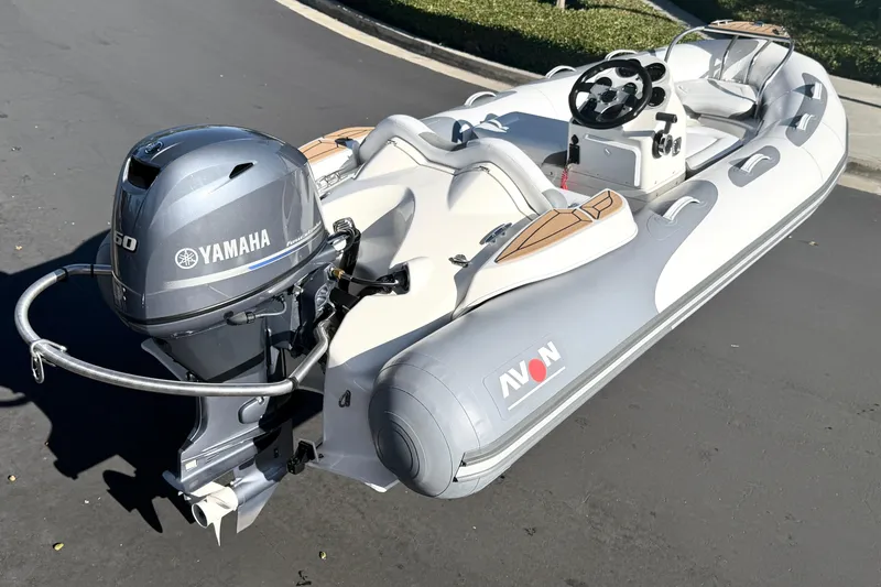 Slide: The Image of 2017 Avon Seasport 420 inflatable boat with Yamaha outboard motor on pavement. - 21
