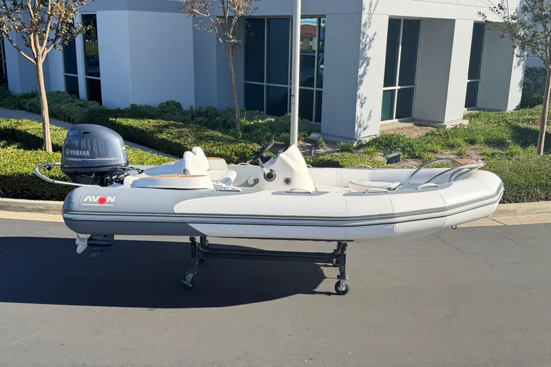 Slide: The Image of 2017 Avon Seasport 420 inflatable boat with Yamaha outboard motor, parked outdoors. - 27