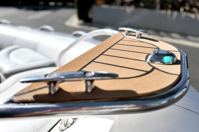 Slide: The Image of Close-up of 2017 Avon Seasport 420 boat deck with chrome fittings and green light. - 4
