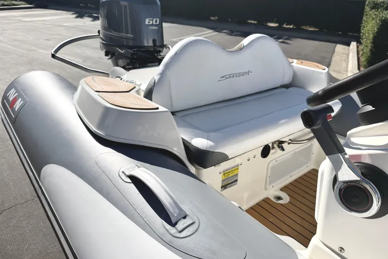 Slide: The Image of 2017 Avon Seasport 420 boat with Yamaha 60 outboard motor, featuring sleek design and comfortable seating. - 5