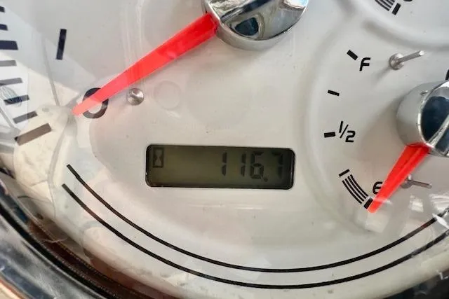 Slide: The Image of Close-up of Barletta E22QC 2019 dashboard gauge showing 116.7 hours. - 10