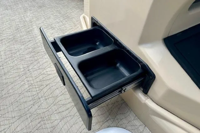 Slide: The Image of 2019 Barletta E22QC boat with a built-in dual cup holder. - 12