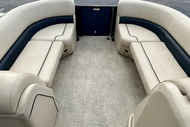 Slide: The Image of 2019 Barletta E22QC boat interior with spacious seating and elegant upholstery. - 5