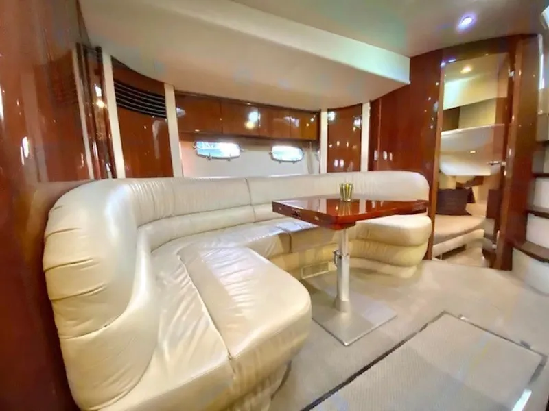 Slide: The Image of Luxurious interior of 2007 Fairline Targa 52 yacht with plush seating and elegant wood finishes. - 14