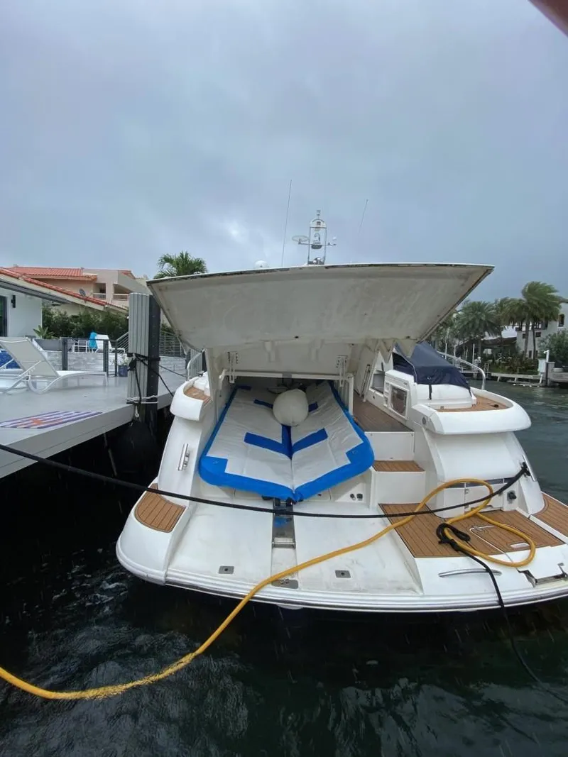 Slide: The Image of 2007 Fairline Targa 52 yacht docked with open garage and paddleboard. - 22