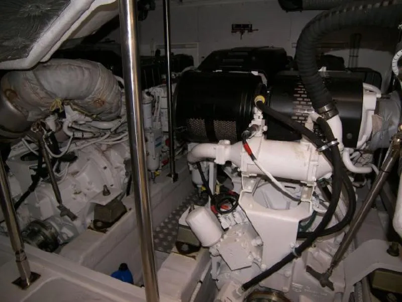 Slide: The Image of Engine room of a 2007 Fairline Targa 52 yacht, showcasing mechanical components. - 27