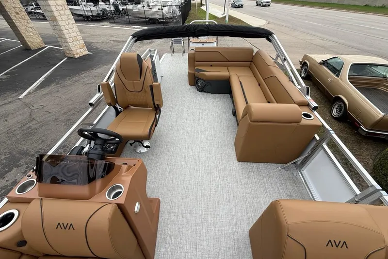Slide: The Image of 2026 Avalon VENTURE 85 CRUISE boat interior with tan seating and modern design. - 10