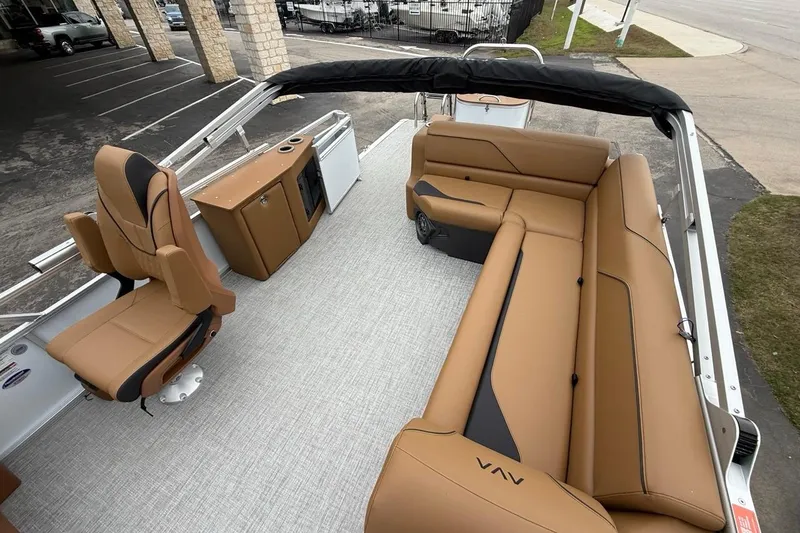 Slide: The Image of 2026 Avalon VENTURE 85 CRUISE boat interior with tan seating and modern design. - 11