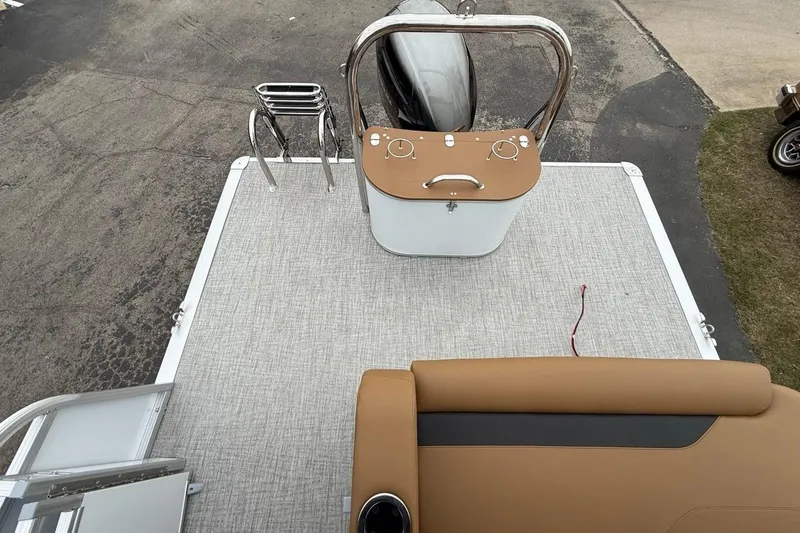 Slide: The Image of 2026 Avalon VENTURE 85 CRUISE boat deck with seating and control console. - 12