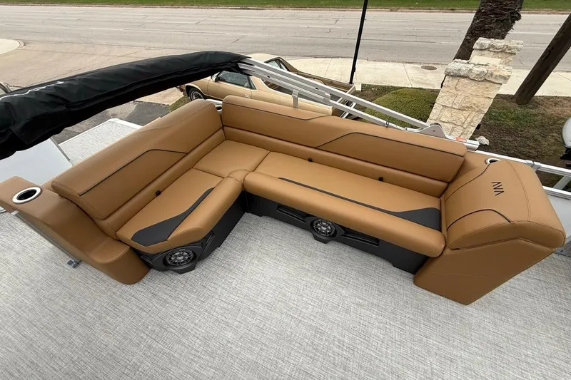 Slide: The Image of Luxurious seating on 2026 Avalon VENTURE 85 CRUISE boat, featuring tan upholstery and integrated speakers. - 13