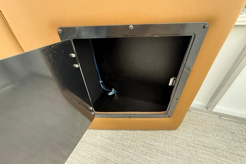 Slide: The Image of Open storage compartment in 2026 Avalon VENTURE 85 CRUISE boat interior. - 19