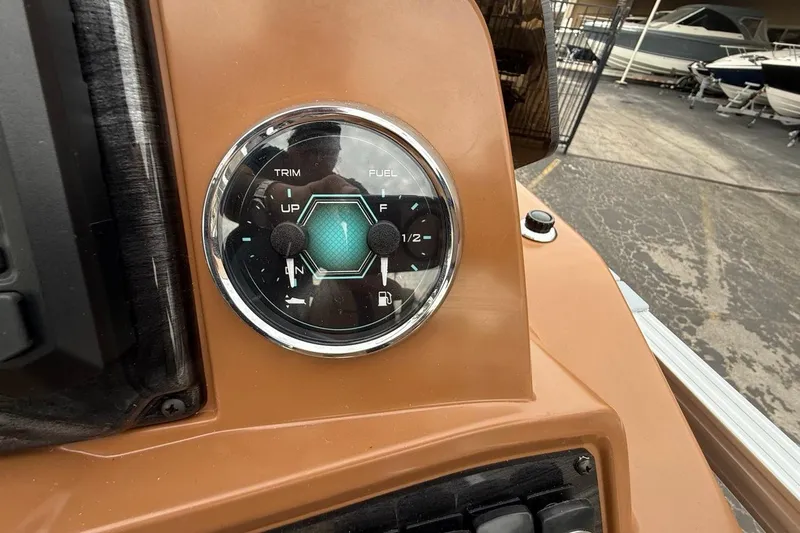 Slide: The Image of Control panel of 2026 Avalon VENTURE 85 CRUISE boat, showing trim and fuel gauges. - 29