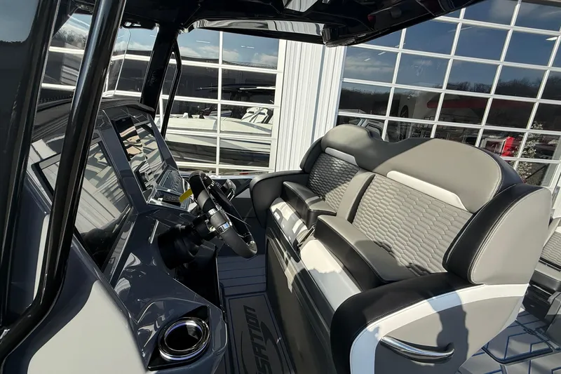 Slide: The Image of Interior of 2026 Sunsation 32 CCX boat with modern dashboard and seating. - 13