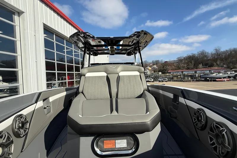 Slide: The Image of 2026 Sunsation 32 CCX boat interior with modern seating and audio system. - 14