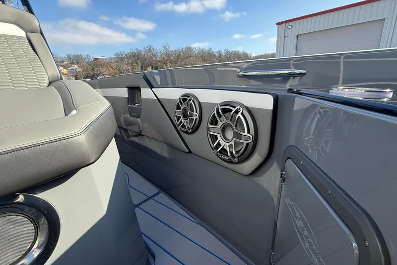 Slide: The Image of 2026 Sunsation 32 CCX boat interior with sleek seating and modern speaker system. - 15