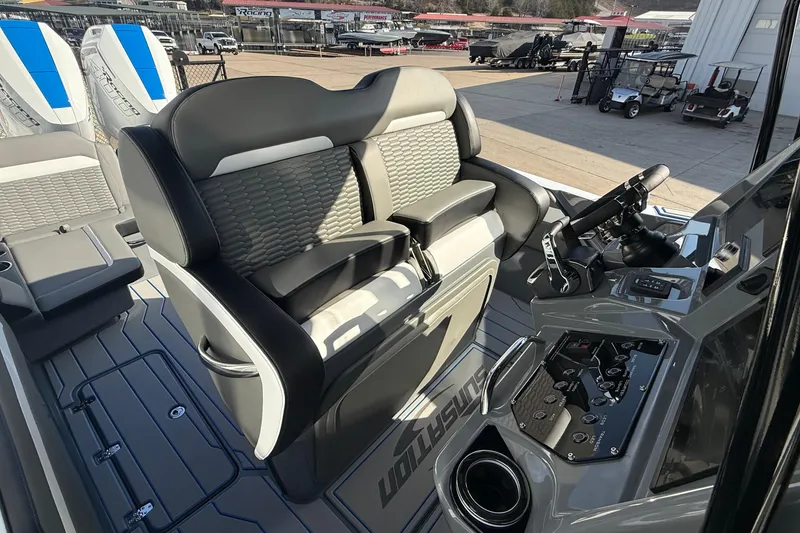 Slide: The Image of 2026 Sunsation 32 CCX boat interior with modern seating and control panel. - 9