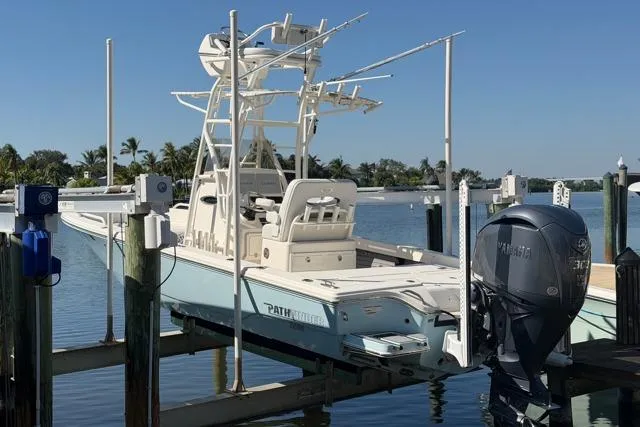The Image of 2023 Pathfinder 2600 TRS boat docked with Yamaha outboard motor. - 0