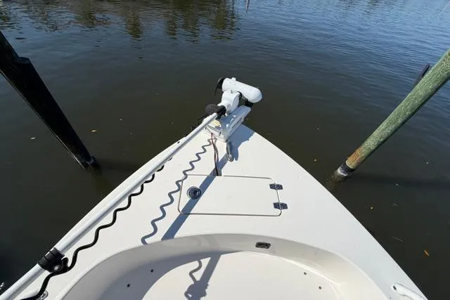 Slide: The Image of 2023 Pathfinder 2600 TRS boat bow with trolling motor on calm water. - 11