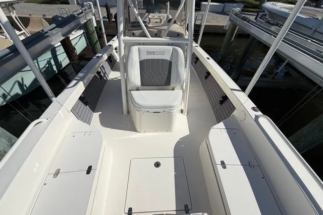 Slide: The Image of 2023 Pathfinder 2600 TRS boat interior, featuring seating and storage compartments. - 13