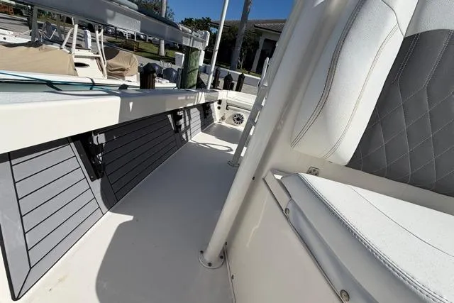 Slide: The Image of 2023 Pathfinder 2600 TRS boat interior with sleek seating and storage compartments. - 15