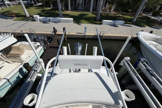 Slide: The Image of 2023 Pathfinder 2600 TRS boat docked at marina, aerial view. - 23