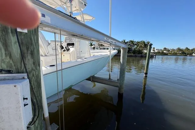 Slide: The Image of 2023 Pathfinder 2600 TRS boat docked on a sunny day by the water. - 25