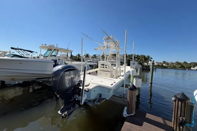 Slide: The Image of 2023 Pathfinder 2600 TRS boat docked, featuring Yamaha outboard motor, under clear blue sky. - 3