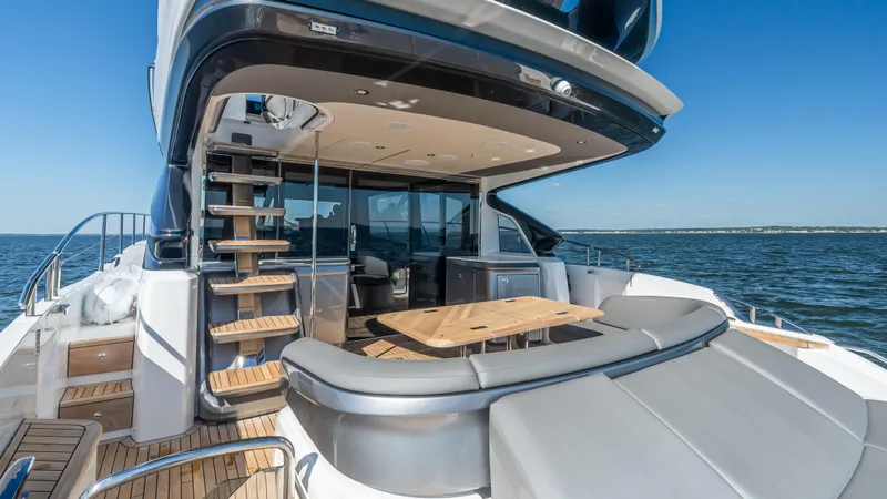 Slide: The Image of 2026 Princess S65 Sportbridge yacht with American flag, Miami skyline in background. - 10