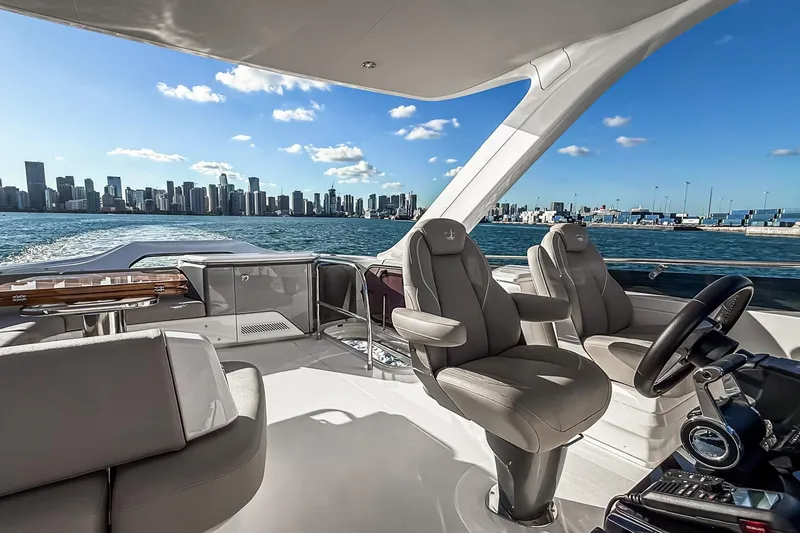 Slide: The Image of Luxurious 2026 Princess S65 Sportbridge yacht interior with city skyline view. - 102