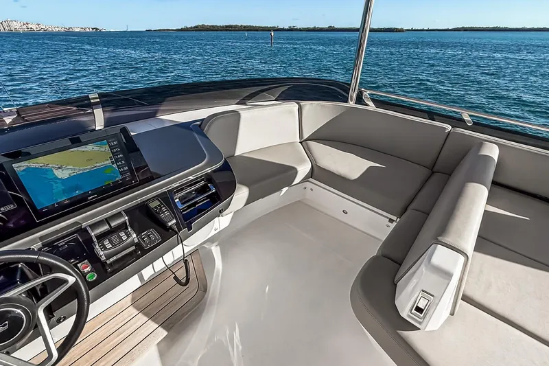 Slide: The Image of Luxurious 2026 Princess S65 Sportbridge yacht interior with navigation system and plush seating. - 104