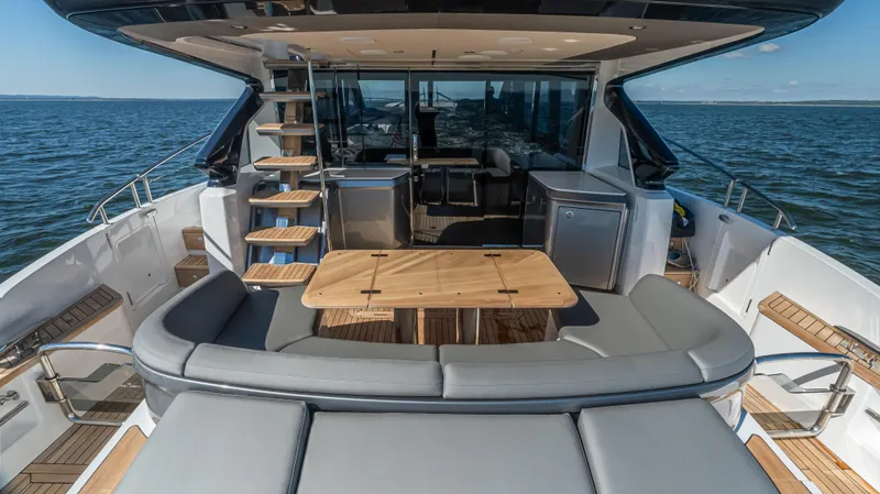 Slide: The Image of Luxury yacht Princess S65 Sportbridge 2026 docked in Miami, skyline in background. - 11