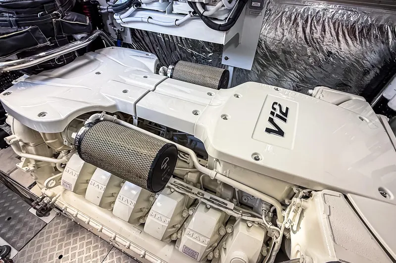 Slide: The Image of Engine room of 2026 Princess S65 Sportbridge yacht featuring a powerful V12 engine. - 111