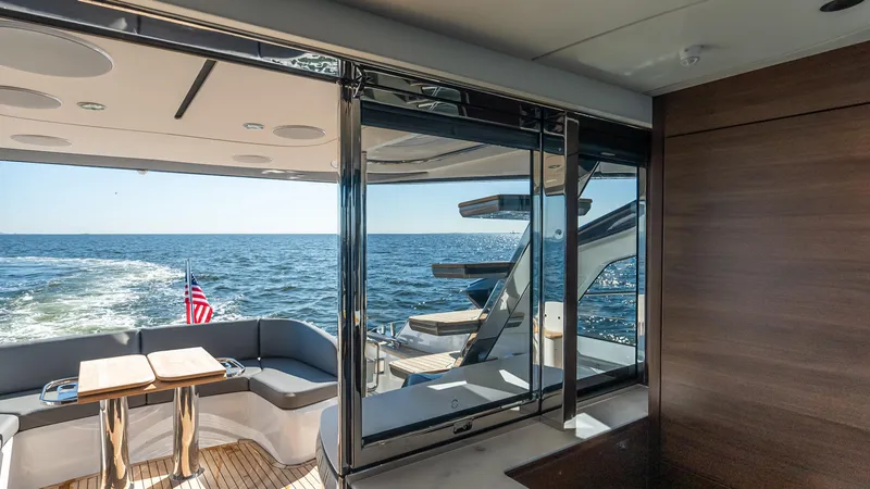 Slide: The Image of Luxurious 2026 Princess S65 Sportbridge yacht with city skyline and American flag. - 15