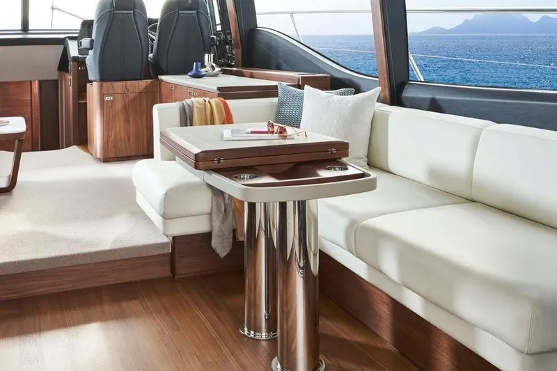 Slide: The Image of Luxurious 2026 Princess S65 Sportbridge yacht deck with ocean view and American flag. - 19